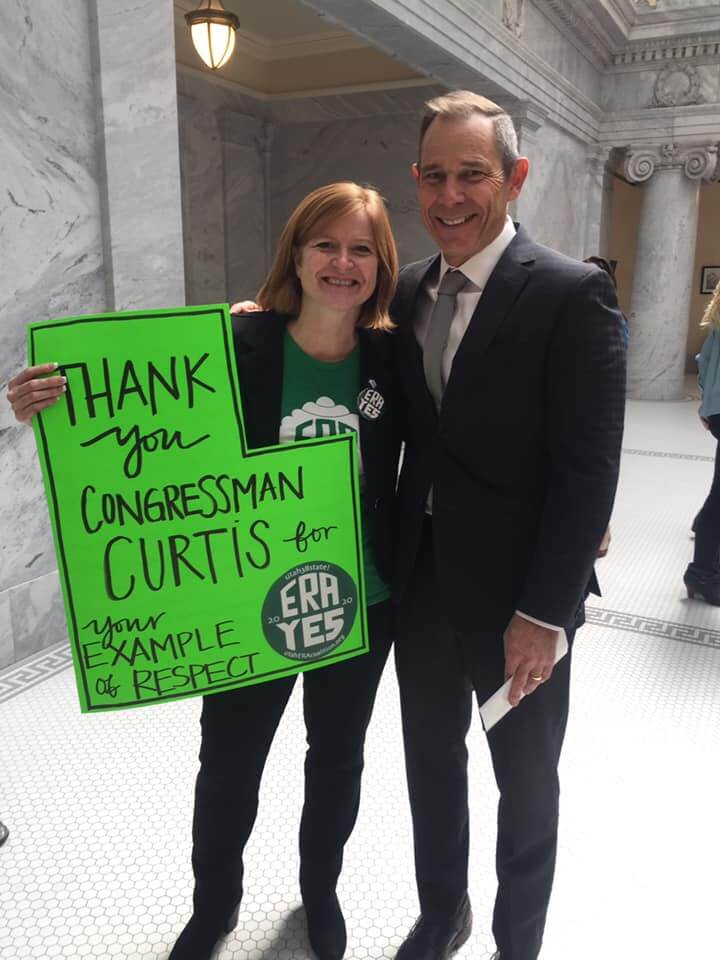 Kelly with Congressman Curtis holding ERA sign